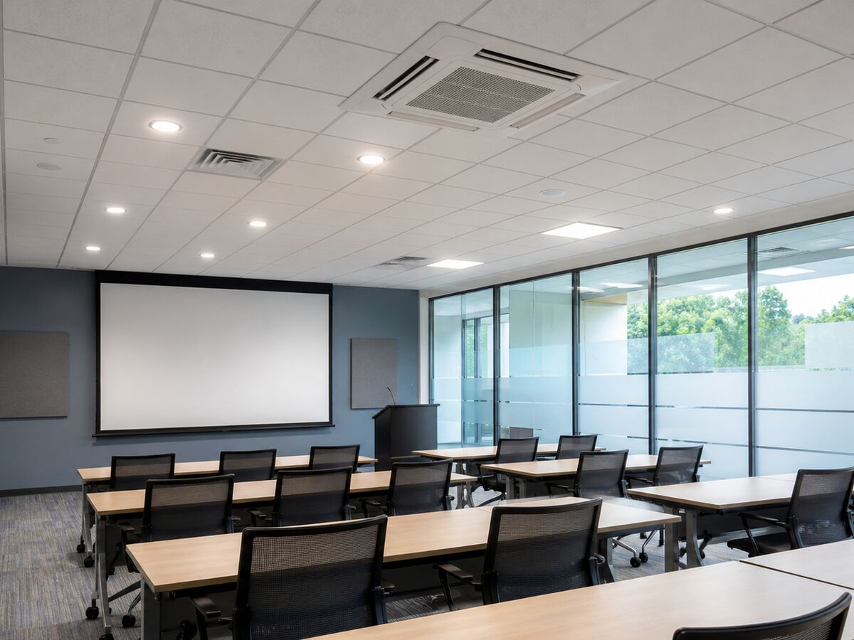 A training room with ceiling cassette air conditioning